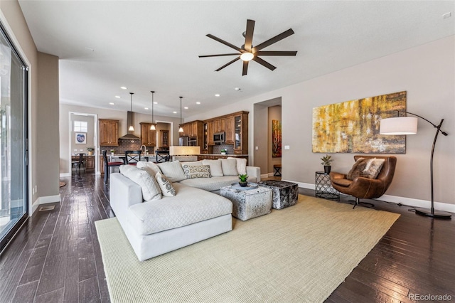 4937 Hogback Ridge Rd, Morrison, CO 80465 - living area featuring recessed lighting, dark wood-style flooring, baseboards, and ceiling fan