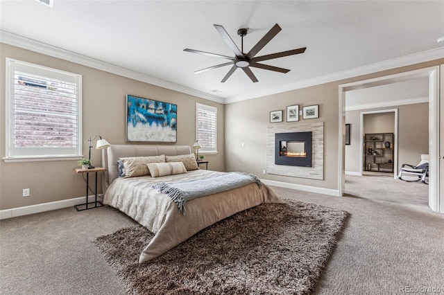 4937 Hogback Ridge Rd, Morrison, CO 80465 - bedroom featuring a glass covered fireplace, ceiling fan, carpet floors, baseboards, and ornamental molding