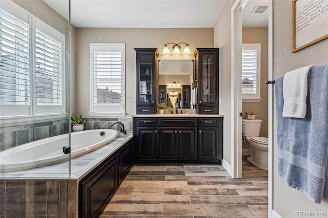 4937 Hogback Ridge Rd, Morrison, CO 80465 - full bath featuring a bath, plenty of natural light, and visible vents