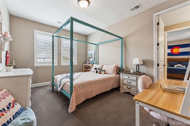 4937 Hogback Ridge Rd, Morrison, CO 80465 - carpeted bedroom with visible vents and baseboards