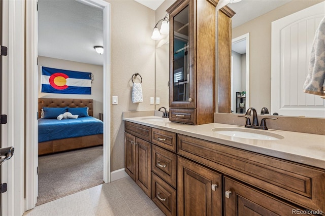 4937 Hogback Ridge Rd, Morrison, CO 80465 - bathroom featuring a sink, double vanity, and ensuite bathroom