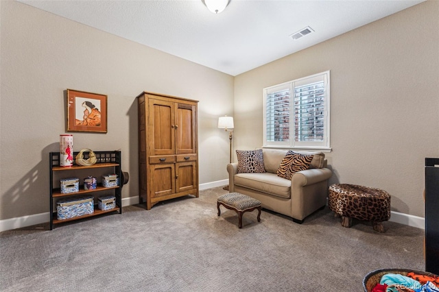4937 Hogback Ridge Rd, Morrison, CO 80465 - living area with baseboards, visible vents, and light colored carpet
