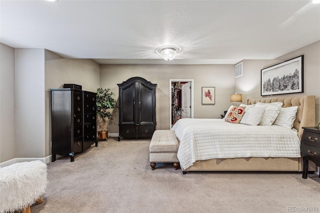 4937 Hogback Ridge Rd, Morrison, CO 80465 - bedroom with a spacious closet, baseboards, carpet flooring, and visible vents