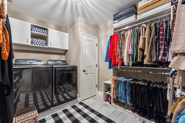 4937 Hogback Ridge Rd, Morrison, CO 80465 - clothes washing area featuring cabinet space and washer and dryer