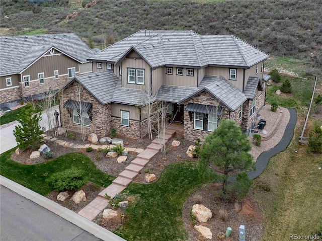 4937 Hogback Ridge Rd, Morrison, CO 80465 - view of front facade featuring board and batten siding and stone siding