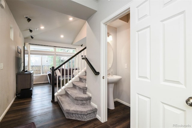 213 S Old Hammer Ct, Aurora, CO 80018 - staircase featuring lofted ceiling, wood finished floors, and recessed lighting