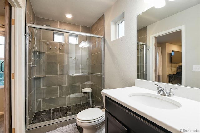 213 S Old Hammer Ct, Aurora, CO 80018 - full bathroom featuring vanity and a stall shower