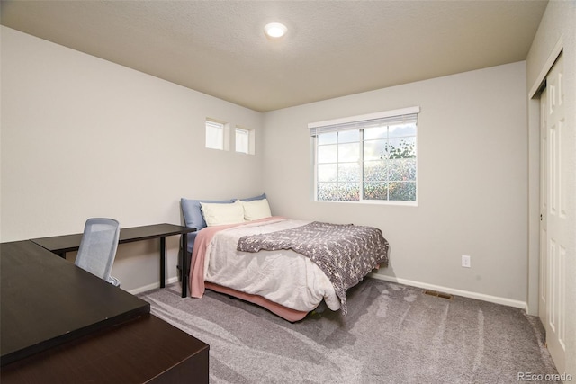 213 S Old Hammer Ct, Aurora, CO 80018 - carpeted bedroom with baseboards and a closet