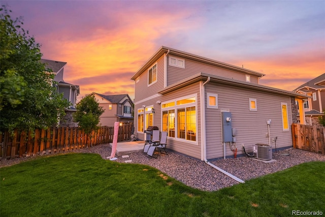 213 S Old Hammer Ct, Aurora, CO 80018 - back of house with a fenced backyard and a patio area
