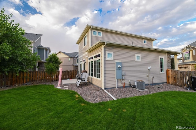 213 S Old Hammer Ct, Aurora, CO 80018 - rear view of house with a fenced backyard and a patio area