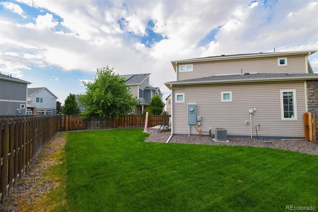 213 S Old Hammer Ct, Aurora, CO 80018 - back of property featuring a fenced backyard, a residential view, and a patio