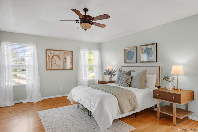 23612 E Mississippi Cir, Aurora, CO 80018 - bedroom with wood finished floors and a ceiling fan