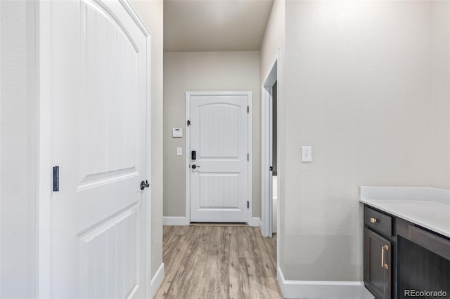 corridor featuring light hardwood / wood-style floors