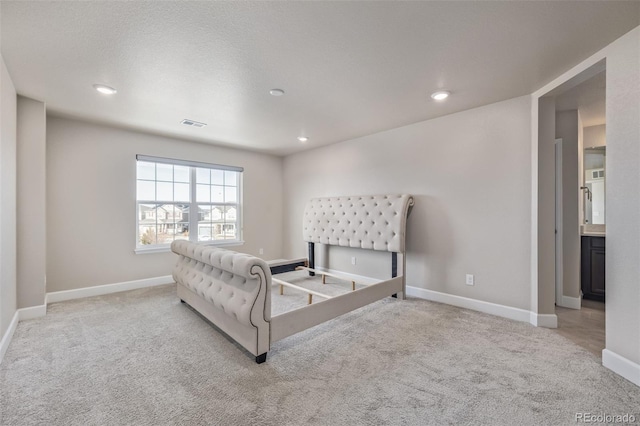 bedroom with light colored carpet