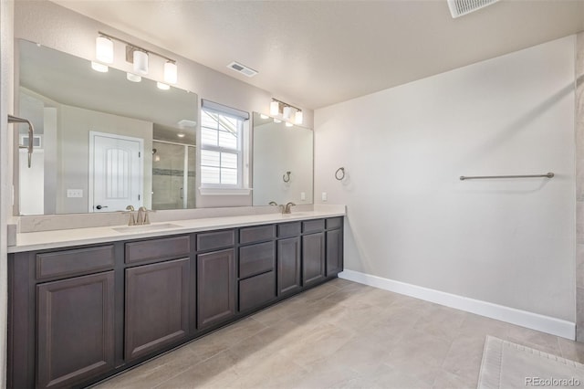 bathroom with vanity and walk in shower