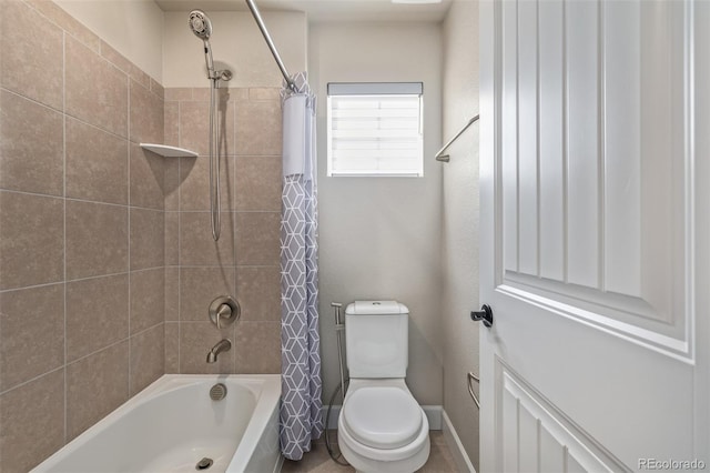 bathroom with toilet and shower / bath combo