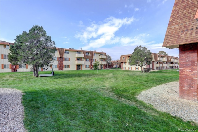 view of home's community with a lawn