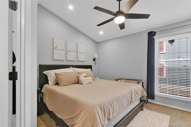 bedroom featuring lofted ceiling, light colored carpet, and ceiling fan