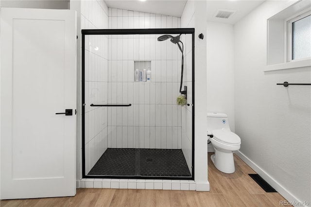 2175 S Joliet St, Aurora, CO 80014 - full bathroom with wood finished floors and a shower stall