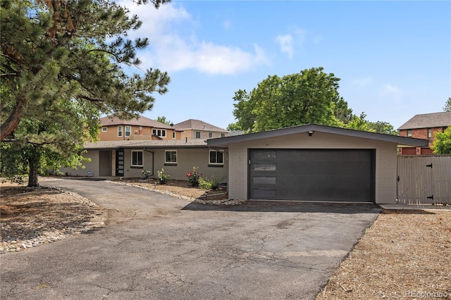 2175 S Joliet St, Aurora, CO 80014 - view of front of house featuring brick siding and asphalt driveway