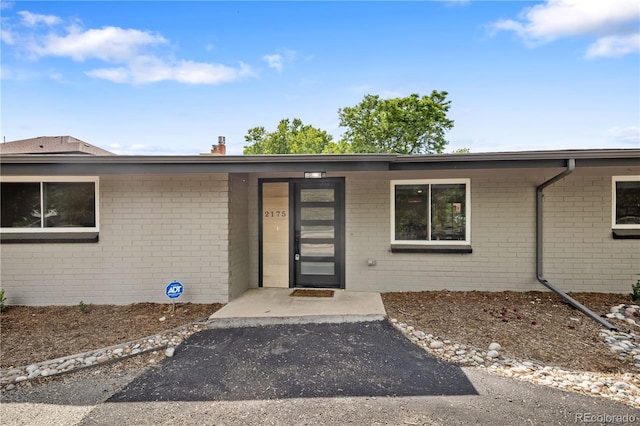 2175 S Joliet St, Aurora, CO 80014 - view of exterior entry featuring brick siding