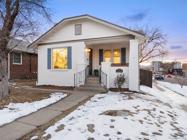 bungalow-style home with a porch