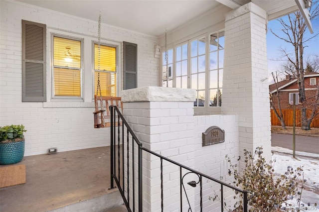 view of snow covered property entrance