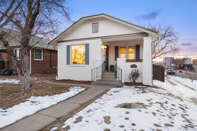 bungalow-style home featuring covered porch