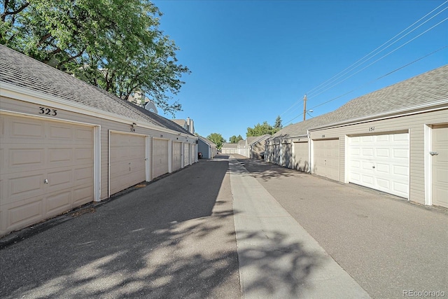 garage featuring wood walls