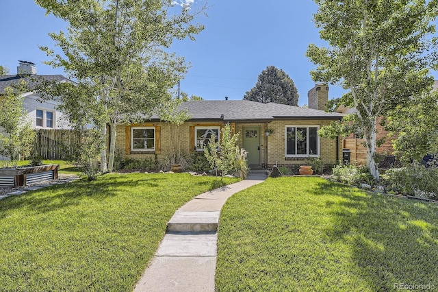 2844 Bellaire St, Denver, CO 80207 - view of front of home with brick siding and a chimney