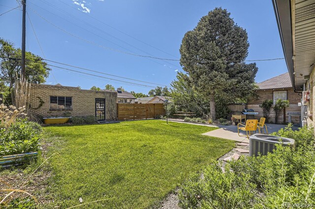 2844 Bellaire St, Denver, CO 80207 - view of yard featuring central AC and a patio