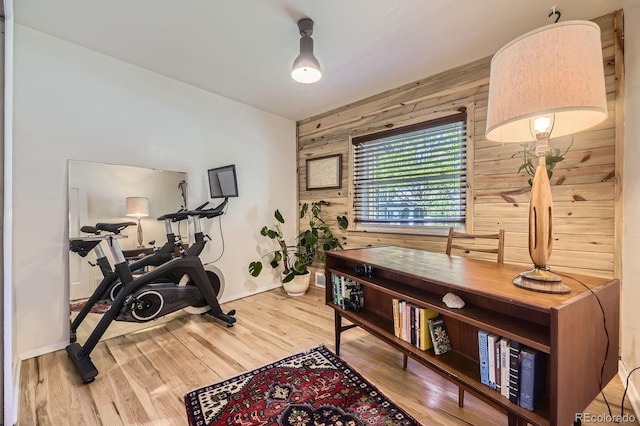 2844 Bellaire St, Denver, CO 80207 - workout area featuring wood walls, baseboards, and wood finished floors