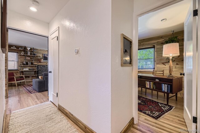 2844 Bellaire St, Denver, CO 80207 - corridor featuring wood finished floors, baseboards, and a textured wall