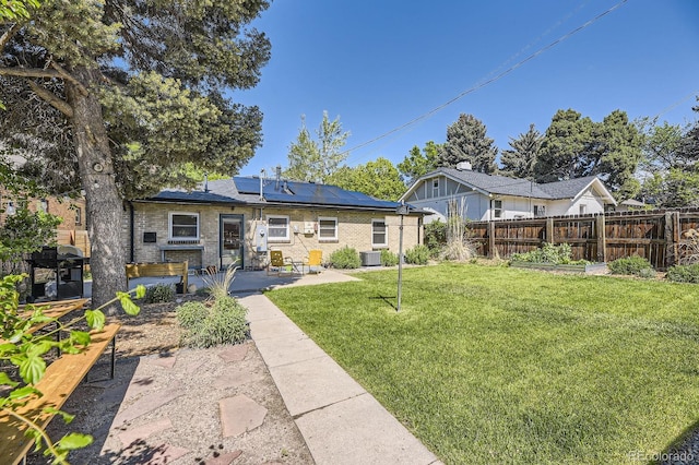 2844 Bellaire St, Denver, CO 80207 - rear view of property with a patio area, roof mounted solar panels, brick siding, and central air condition unit