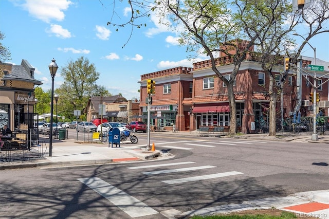 2844 Bellaire St, Denver, CO 80207 - view of asphalt street featuring sidewalks, street lights, curbs, and a residential view