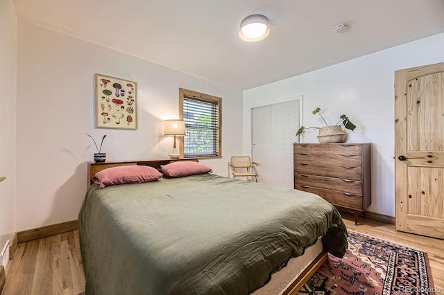 2844 Bellaire St, Denver, CO 80207 - bedroom featuring light wood-style floors and baseboards