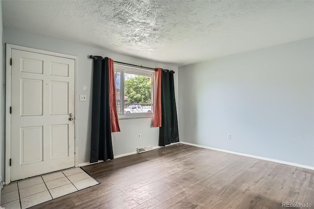 5274 Alkire St, Arvada, CO 80002 - entrance foyer featuring wood finished floors and a textured ceiling