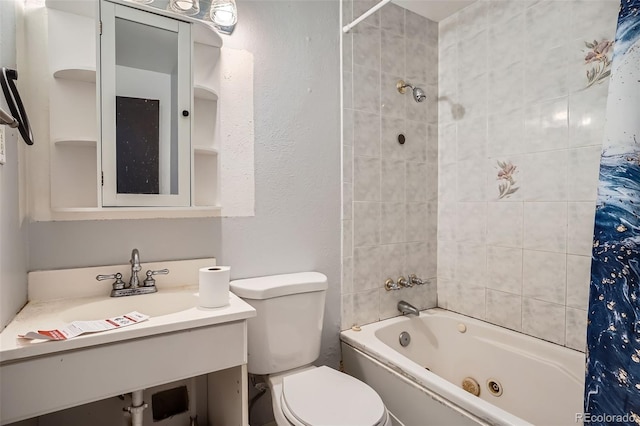 5274 Alkire St, Arvada, CO 80002 - bathroom featuring a combined bath / shower with jetted tub, vanity, and a textured wall