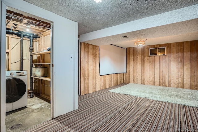 5274 Alkire St, Arvada, CO 80002 - finished below grade area with washer / clothes dryer, wooden walls, and a textured ceiling
