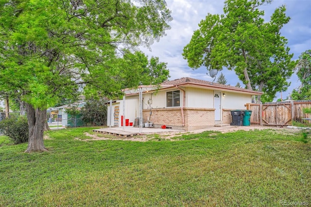 5274 Alkire St, Arvada, CO 80002 - rear view of property with brick siding and a patio