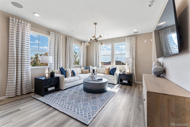 23782 E 33rd Pl, Aurora, CO 80019 - living room with a chandelier, light wood-style flooring, baseboards, and recessed lighting