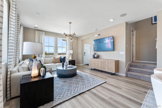 23782 E 33rd Pl, Aurora, CO 80019 - living area featuring wood finished floors, a chandelier, baseboards, stairs, and recessed lighting