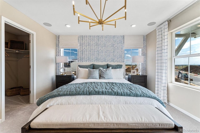 23782 E 33rd Pl, Aurora, CO 80019 - carpeted bedroom featuring a chandelier, multiple windows, a spacious closet, baseboards, and recessed lighting