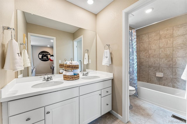23782 E 33rd Pl, Aurora, CO 80019 - bathroom featuring toilet, double vanity, shower / tub combo with curtain, and tile patterned flooring