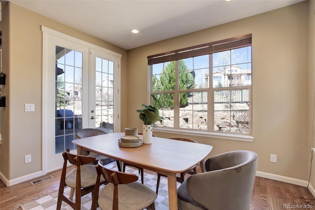 dining room featuring visible vents, recessed lighting, wood finished floors, french doors, and baseboards