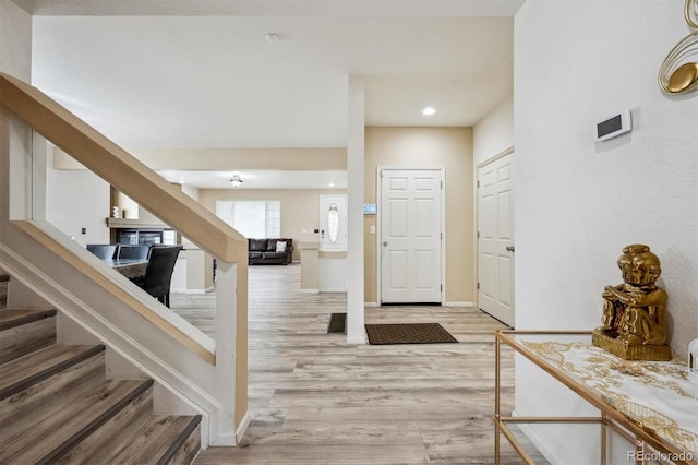 5293 Malaya St, Denver, CO 80249 - entryway featuring light wood-style flooring, baseboards, recessed lighting, and stairway