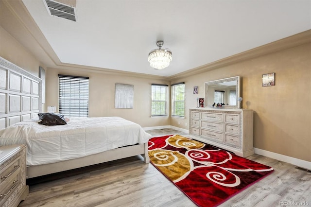 5293 Malaya St, Denver, CO 80249 - bedroom featuring baseboards, a chandelier, visible vents, and light wood-type flooring