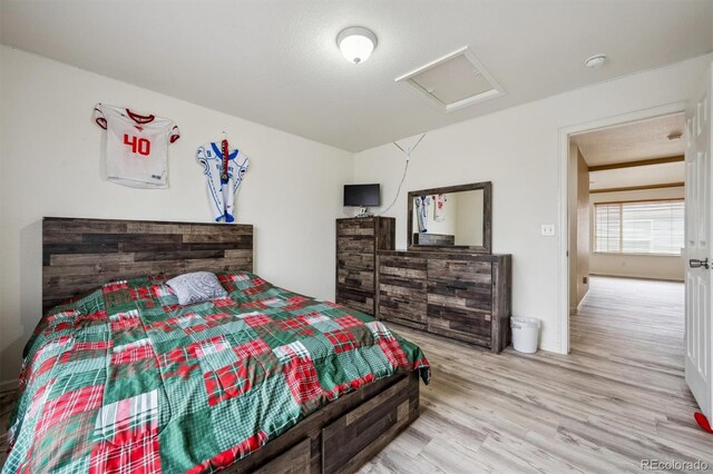 5293 Malaya St, Denver, CO 80249 - bedroom with attic access and wood finished floors