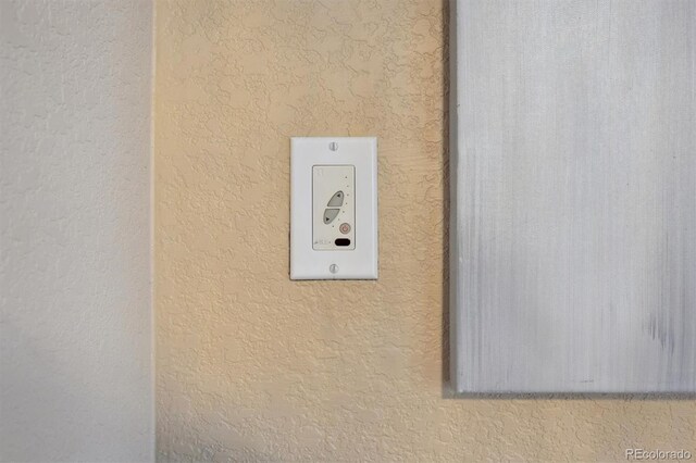 5293 Malaya St, Denver, CO 80249 - room details featuring a textured wall
