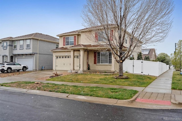 5293 Malaya St, Denver, CO 80249 - traditional-style home featuring driveway, fence, an attached garage, a front yard, and stucco siding